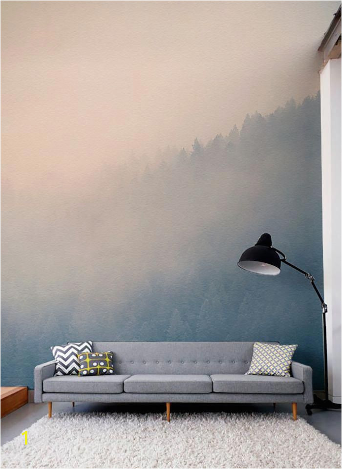 Gaze across the treetops with the beautifully hazy forest wall mural Soft pastels colour make this a soothing wallpaper for living room spaces