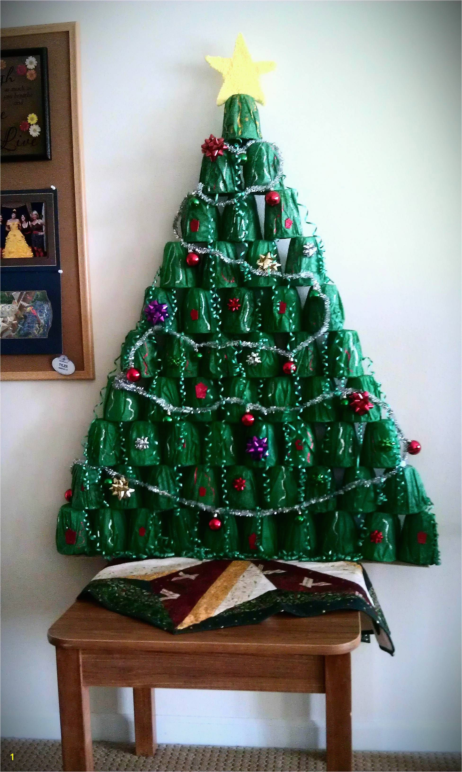 My roomates and I made a Christmas tree out of plastic cups t tissue dollar tree decorations and silly putty for the star Assembled with super glue