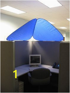 CubeShieldâ¢ blocks out bothersome overhead lights while providing added personalization and privacy to office cubicles