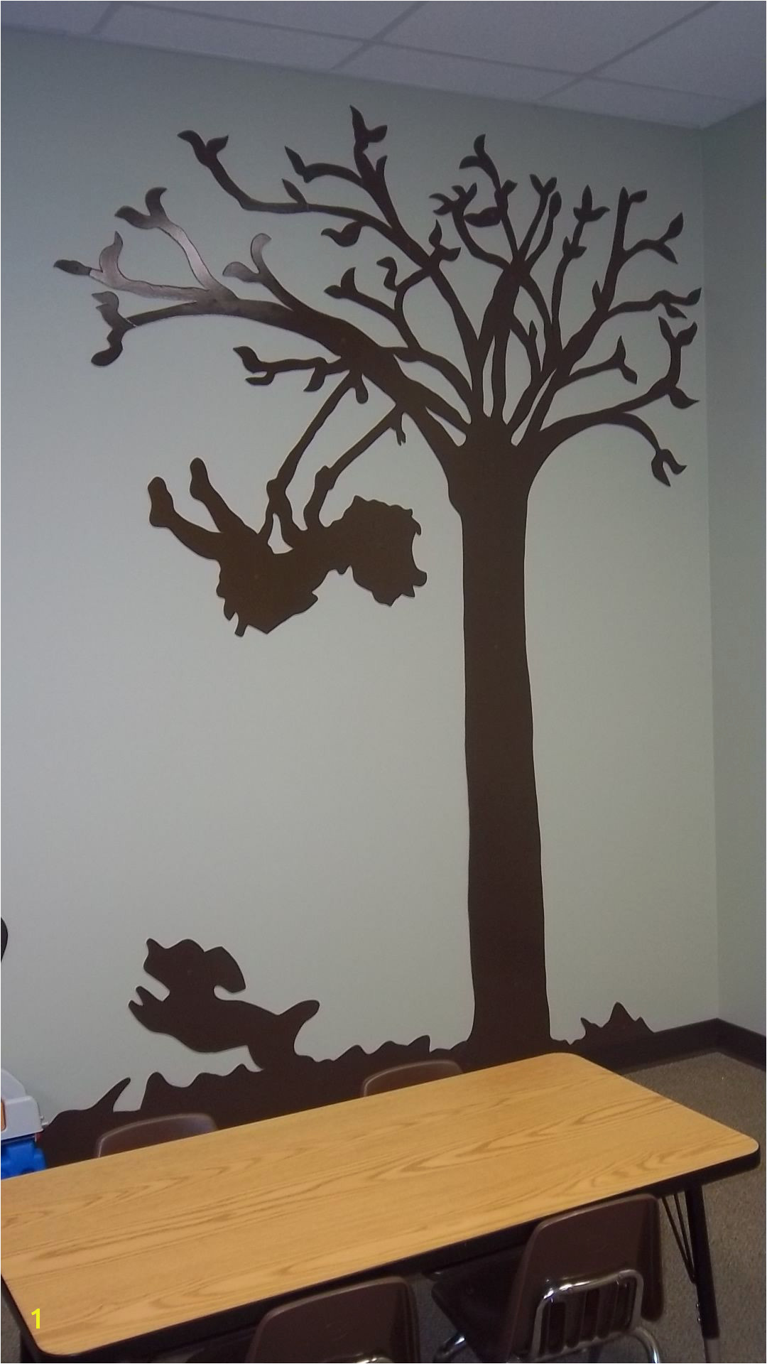 Silhouette of child swinging in church nursery