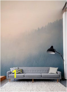 Gaze across the treetops with the beautifully hazy forest wall mural Soft pastels colour make