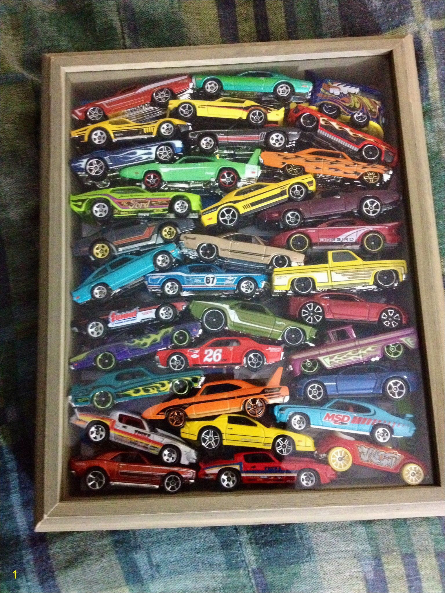 8x10 shadow box loaded with Hot Wheels good way to store and display those cars that got unpackaged to play with hotwheels