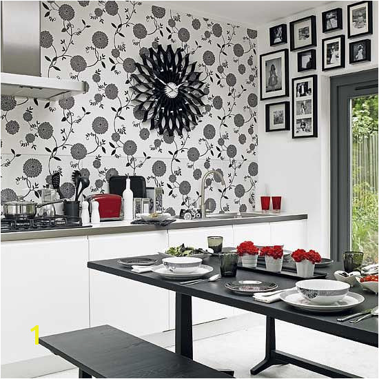 Not loving the wall paper but I love the black and white with the red accent and of course the picture frames