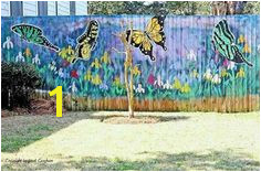 Gorgeous butterfly mural on the fence I want to do this so terribly badly Like Drew Barry Moore to a garage in 50 first dates Gardens And Thyme