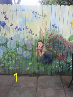 Fairy blowing bubbles in garden mural