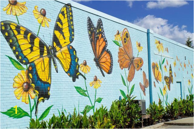 Lovely butterfly mural by artist Chip Wilkinson in South Norfolk on the outside wall of the Portlock Galleries