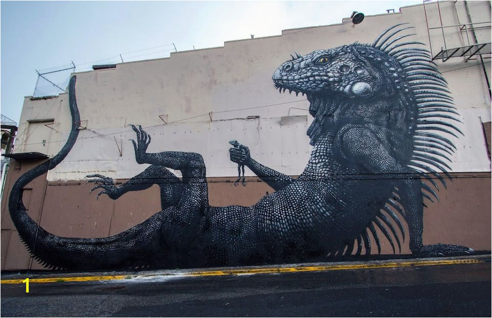 Belgian artist ROA just pleted his latest mural for the Los Muros Hablan Festival in San Juan Puerto Rico The massive mural features an Iguana holdi