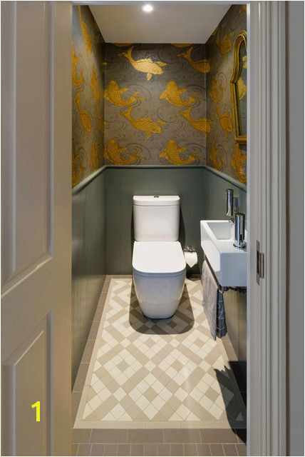 traditional cloakroom with gold fish wallpaper at battersea house