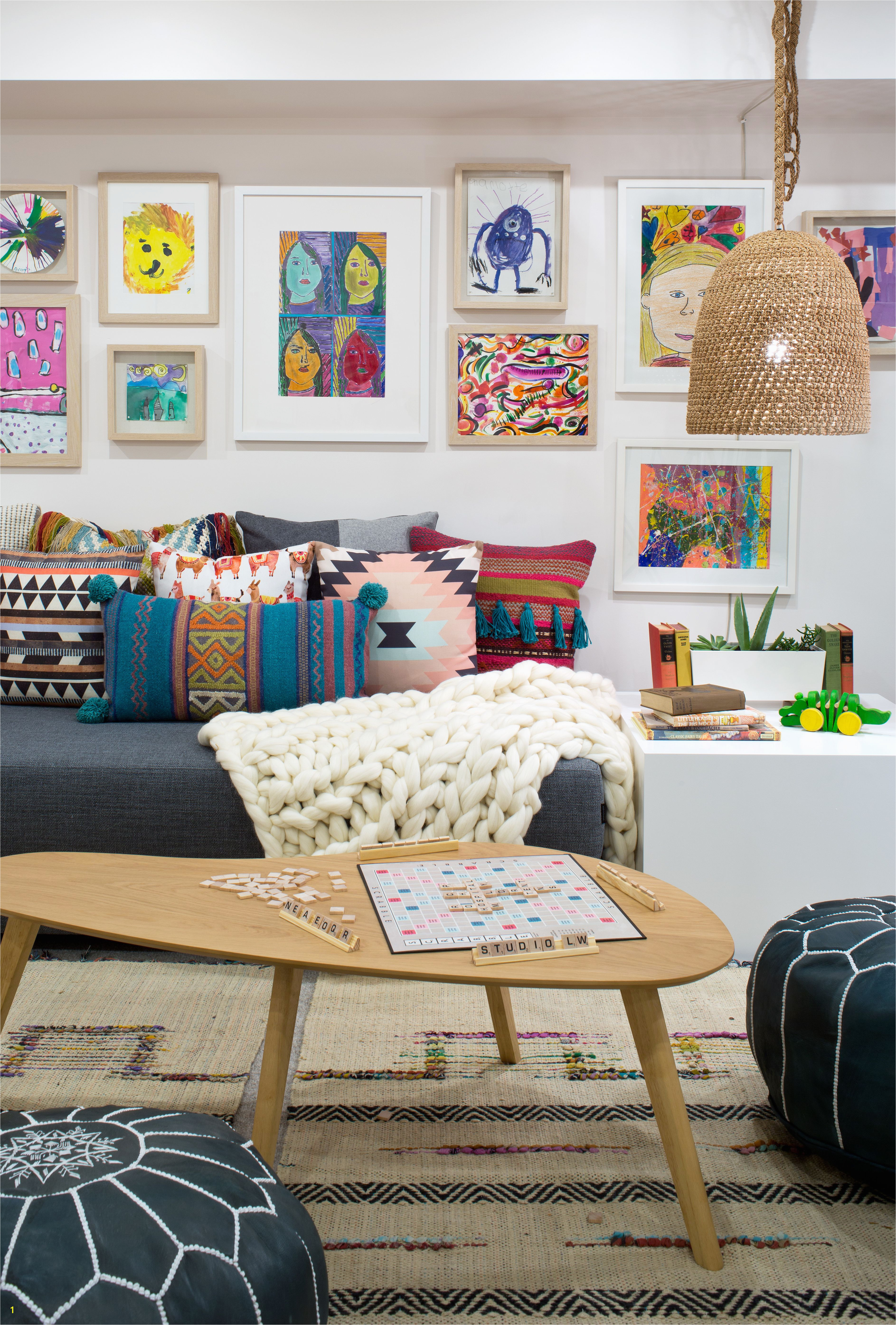 Kid s basement playroom Love the colors in the kid s art gallery wall Paleck Pendant hangs over a lacquer table Adorable