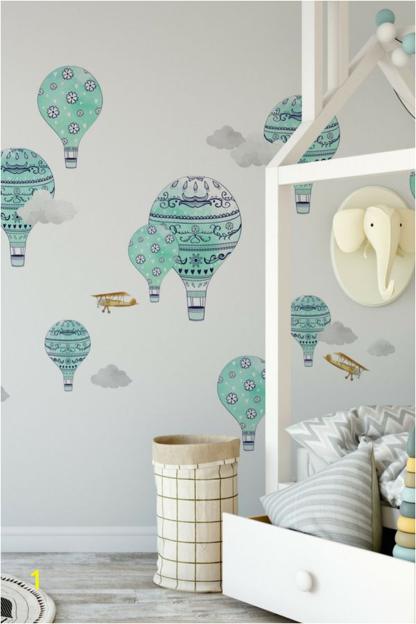 Soar through the clouds on a whimsical hot air balloon or golden biplane These hand painted decals will take your nursery to new heights