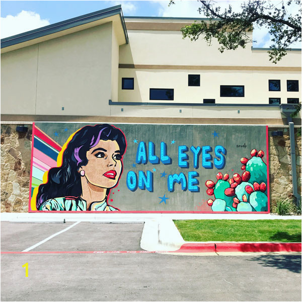 A Building Has A Mural Painted On An Outside Wall All Eyes On Cedar Park Vision Womeninoptometry