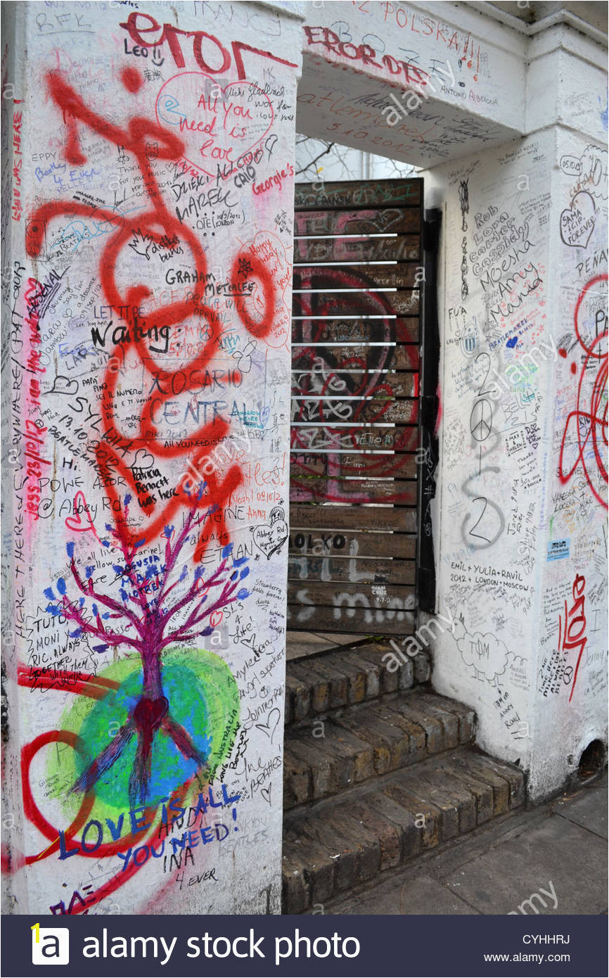 messages on wall outside abbey road studio london made famous by the CYHHRJ