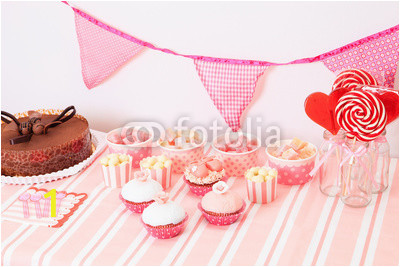 dessert table in pink at girls birthday party