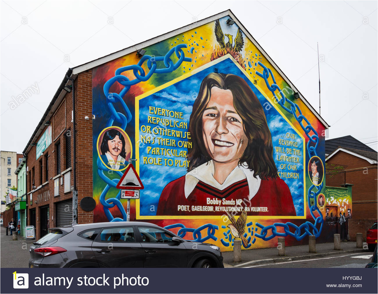 wall mural depicting bobby sands on the side of the sinn fin office HYYGBJ