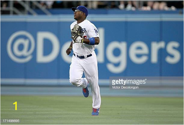 yasiel puig of the los angeles dodgers jogs out the play after making picture id