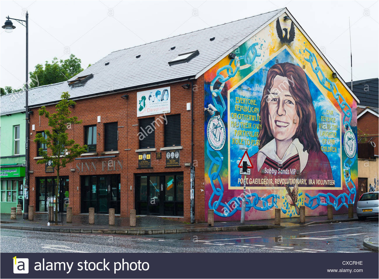 sinn fein constituency office with mural of bobby sand on catholic CXCRHE