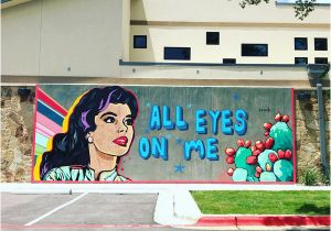 A Building Has A Mural Painted On An Outside Wall All Eyes On Cedar Park Vision Womeninoptometry