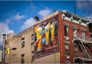 A Building Has A Mural Painted On An Outside Wall Blue Moon Painted Ad In Manhattan