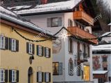A Building Has A Mural Painted On An Outside Wall Snowy Street Of Garmisch Partenkirchen with Unique Murals On