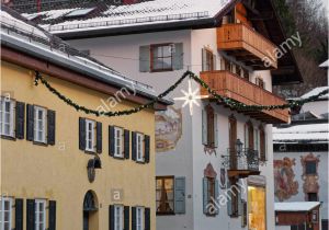 A Building Has A Mural Painted On An Outside Wall Snowy Street Of Garmisch Partenkirchen with Unique Murals On