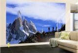 Hollywood Sign Wall Murals Wall Mural Hikers On A Ridge Dwarfed by Cerro torre